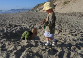 Johanna and Antti digging a hole